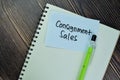 Concept of Consignment Sales write on sticky notes isolated on Wooden Table