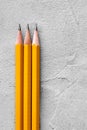 Concept of construction, sharpened pencils on a background of gray plaster texture, space for text Royalty Free Stock Photo