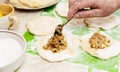 The concept of cooking at home. The process of laying the filling on the dough