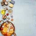 Concept cooking homemade vegetarian pasta with cherry tomatoes, parmesan cheese, quail eggs and seasonings, pasta in copper bowl Royalty Free Stock Photo