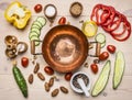 Concept cooking salad of various spices and herbs vegetables, laid out around copper bowls for salad , place for text