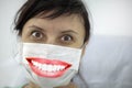 Concept of coronavirus quarantine, new virus - covid-19, woman urges everyone to wear masks, the mask shows a beautiful smile Royalty Free Stock Photo