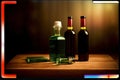 A Couple Of Bottles Sitting On Top Of A Wooden Table. Generative AI