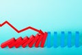 Concept of covid19 coronavirus pandemic with falling chain like a domino game and decreasing statistic arrow