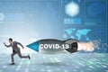 Concept of covid crisis with businessman chased by rocket Royalty Free Stock Photo