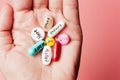 The concept of creative pills, a placebo in the hand, with joy, love, happiness, truth, power, dream