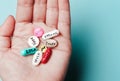 Concept of creative pills, a placebo in the hand, with joy, love, happiness, truth, power, dream