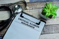 Concept of Critical Illness Insurance write on paperwork isolated on wooden background Royalty Free Stock Photo