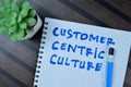 Concept of Customer Centric Culture write on book isolated on Wooden Table Royalty Free Stock Photo