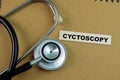 Concept of Cyctoscopy write on sticky notes with stethoscope isolated on Wooden Table Royalty Free Stock Photo