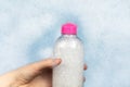 Bottles of detergents float in the foam. The concept of the dangers of household chemicals. Sodium laureate, parabens, sulfates