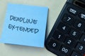 Concept of Deadline Extended write on sticky notes isolated on Wooden Table Royalty Free Stock Photo