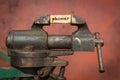 Vice grip tool squeezing a plank with the word phoner Royalty Free Stock Photo