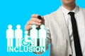 Concept of DEI - Diversity, Equality, Inclusion. Businessman pointing at virtual image of people and person with disability on