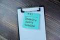 Concept of DEI - Diversity Equity Inclusion write on sticky notes isolated on Wooden Table Royalty Free Stock Photo