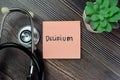 Concept of Delirium write on sticky notes isolated on Wooden Table