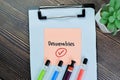 Concept of Deliverables write on sticky notes isolated on Wooden Table