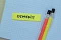 Concept of Demerit write on sticky notes isolated on Wooden Table