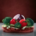 Concept design image for cookbook or magazine cover vegetables on a wooden platter on a dark background