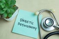 Concept of Diabetic Retinopathy write on sticky notes with stethoscope isolated on Wooden Table