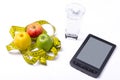 Concept of diet, fresh apples and a glass of water on a light ba Royalty Free Stock Photo