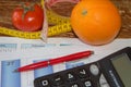 Concept of diet. Low-calorie vegetables diet. Diet for weight loss. Measuring tape and vegetables on the table Royalty Free Stock Photo