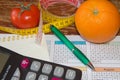 Concept of diet. Low-calorie vegetables diet. Diet for weight loss. Measuring tape and vegetables on the table Royalty Free Stock Photo