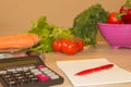 Concept of diet. Low-calorie vegetables diet. Diet for weight loss. Measuring tape and vegetables on the table Royalty Free Stock Photo