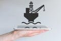 Concept of digital and mobile oil and gas business. Hand holding modern smart phone Royalty Free Stock Photo