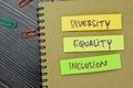 Concept of Diversity, Equality, Inclusion write on sticky notes isolated on Wooden Table Royalty Free Stock Photo