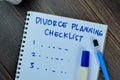 Concept of Divorce Planning Checklist write on book isolated on Wooden Table