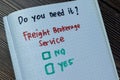 Concept of Do You Need it? Freight Brokerage Service. Yes or No write on book isolated on Wooden Table