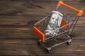Concept dollar money banknotes in a shopping trolley
