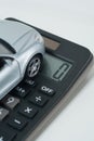 Zero, calculator, a model car. Royalty Free Stock Photo
