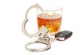 Concept for drinking and driving. Whiskey with car keys and handcuffs. Royalty Free Stock Photo