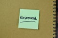 Concept of Easement write on sticky notes isolated on Wooden Table Royalty Free Stock Photo