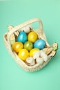Concept of Easter eggs on mint background Royalty Free Stock Photo