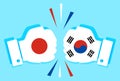 concept of economic and patriotic confrontation between the two countries. Flags of Japan and South Korea on fists colliding with