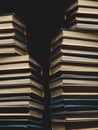 Concept Of Education And Knowledge. Tower Building Of Old Multicolored Books On A Black Background Royalty Free Stock Photo