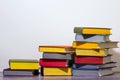 Concept of education and preparation for school. Split-level of colorful book stacks on the white background.