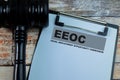 Concept of EEOC - Equal Employment Opportunity Commision write on paperwork isolated on wooden background