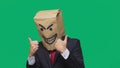 Concept of emotion, gestures. a man with a package on his head, with a painted smiley angry, sly, gloating Royalty Free Stock Photo