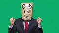 Concept of emotion, gestures. a man with a package on his head, with a painted smiley angry, sly, gloating, devil Royalty Free Stock Photo