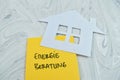 Concept of Energie Beratung write on sticky notes isolated on Wooden Table