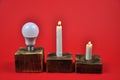 The concept of energy saving. A diode lamp and candles Royalty Free Stock Photo