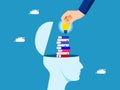 The concept of enhancing learning. A pile of books in a human head with a businessman hand holding a light bulb