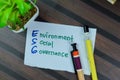 Concept of ESG - Environment Social Governance write on sticky notes isolated on Wooden Table Royalty Free Stock Photo