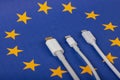 Concept for EU law to force USB-C chargers for all phones. EUROPEAN UNION flag and USBC universal