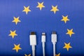 Concept for EU law to force USB-C chargers for all phones. EUROPEAN UNION flag and USBC universal