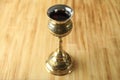 Concept of Eucharist with goblet of wine on wooden background